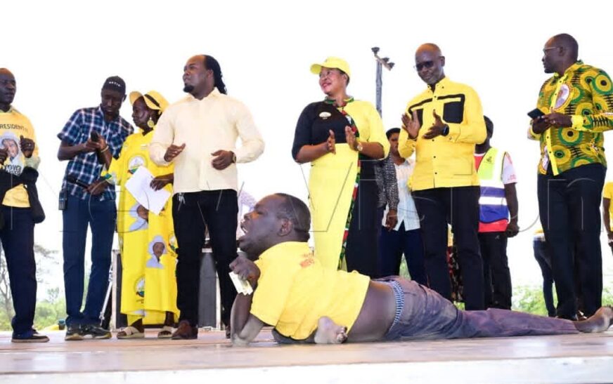 Jimmy Obete, an Artist and a PWD from Kole, Performs for NRM Supporters at the Rally in Kole District